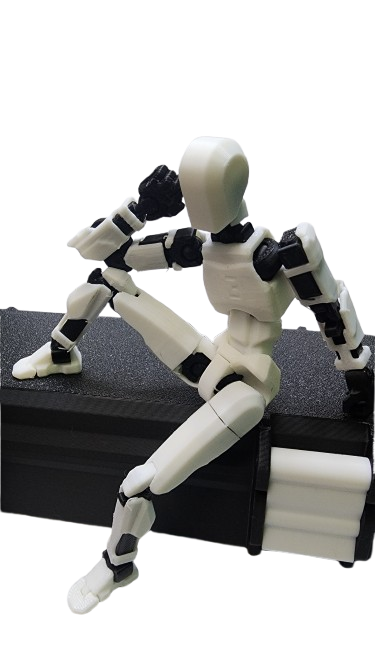 Articulated action figure in a seated pose on a storage case